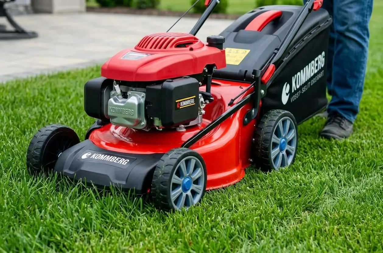 Professional lawn mowing service using a red lawn mower on lush green grass.